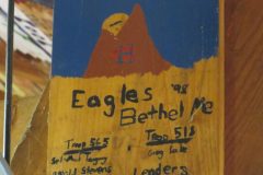Troop 565 and Troop 518 plaque from 1998 at Camp Hinds in Ring Hall. They stayed in MacMillan. Located in the middle rafters of bay 1.