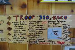 Troop 310 plaque from 2021 at Camp Hinds. They are from Saco and stayed in Pershing. It is located in the Dining Hall.