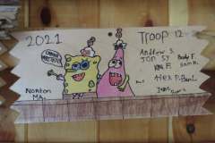 Troop 12 plaque from 2021 at Camp Hinds. They are from Newton, MA. Located in the Dining Hall.