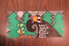 Troop 323 plaque from 2025 at Camp Hinds in the dining hall. Located in the dining hall.