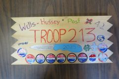 Troop 213 plaque from 2025 at Camp Hinds in the dining hall. Located in the dining hall.