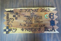 Troop 320 plaque from 2025 at Camp Hinds in the dining hall. They stayed in Ridgway campsite. Located in the dining hall.