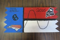 Troop 38 plaque from 2025 at Camp Hinds in the dining hall. They are from Southport, NC. Located in the dining hall.