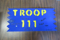 Troop 111 plaque from 2025 at Camp Hinds in the dining hall. They stayed in West campsite. Located in the dining hall.