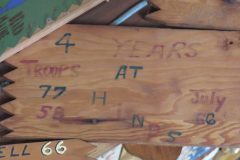 Troop 77 and Troop 58 plaque at Camp Hinds in Ring Hall from 1966. Located in the middle rafters of bay 1.