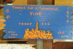 Troop 246 plaque from 1970 at Camp Hinds in Ring Hall. They stayed in Baden Powell. They were from New York City, New York. Located in the middle rafters of bay 1.