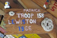 Troop 158 plaque from 1966 at Camp Hinds. They are from Lewiston and stayed in Patrick. Located in the middle rafters of bay 1 of Ring Hall.