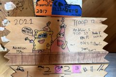 Troop 12 plaque from 2021 at Camp Hinds. They are from Norton, MA. Located in the dining hall.