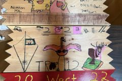 Troop 12 plaque from 2023 at Camp Hinds. They are from Norton, MA. Located in the dining hall.